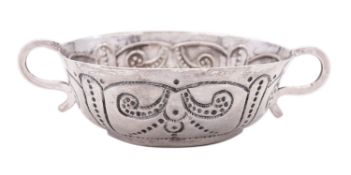 A rare Charles I silver wine taster or tastevin maker's mark poorly struck, possibly I?H,