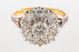 An 18ct gold diamond cluster ring, of flowerhead form and set with brilliant-cut diamonds,