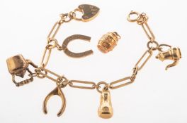 A 9ct gold charm bracelet with charms,