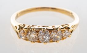 A five stone diamond ring, claw and grain set with five graduated old-cut diamonds,