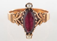 A Victorian garnet and pearl ring, claw set with a marquise-cut garnet,