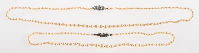 Ciro. A pearl necklace and a faux pearl necklace, a