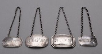 A mixed group of silver wine labels including; Brandy by Jay, Richard Attenborough & Co ,
