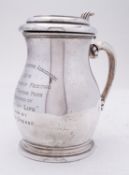 A George V silver lidded tankard by Goldsmiths & Silversmiths Co Ltd, London 1914, of baluster form,