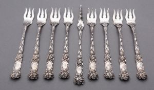 A set of eight late 19th century American sterling silver snail forks and an auger by