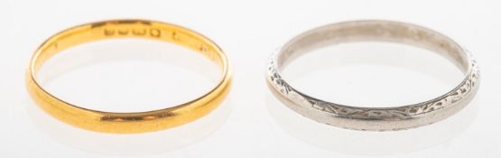 A 22ct gold wedding band and one other wedding band, a 22ct gold wedding band, UK hallmark,
