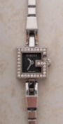 Gucci a lady's stainless-steel and diamond wristwatch the dial signed Gucci, Swiss Made,