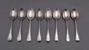 A matched set of Old English and Bead pattern dessert spoons mostly by Robert Stewart,