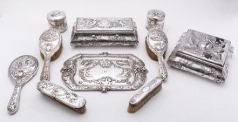 A Victorian matched ten piece silver dressing table set mostly by Elkington & Co Ltd Birmingham,
