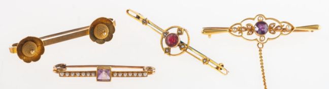 A group of four brooches,