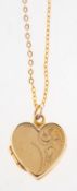 A heart locket with chain, a heart locket with half foliate engraving to front panel,