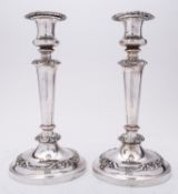 A pair of mid 19th century Sheffield plated candlesticks,