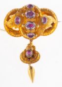 An Etruscan revival brooch, an ornately designed gilt brooch with floral and foliate carving,
