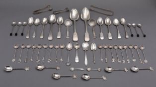 A mixed group of silver spoons including; two Fiddle pattern table spoons, eleven tea spoons,