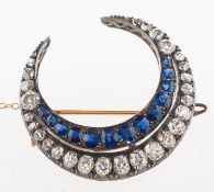 An impressive Victorian diamond and sapphire crescent moon brooch,