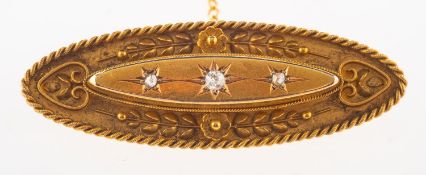 A 15ct gold Victorian diamond set brooch, with carved floral,