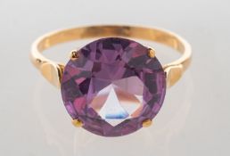 A synthetic alexandrite ring, claw set with a circular-cut synthetic alexandrite, approx. 5.