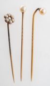 A group of three pearl stick pins,