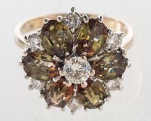 A diamond and andalusite cluster ring, of flowerhead form,