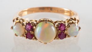 An opal and ruby ring, an openwork 'gypsy' style ring,