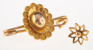 A small group of jewellery, including an antique flower brooch, marked 15ct, length approx. 3.