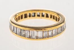 A baguette-cut diamond full eternity ring,