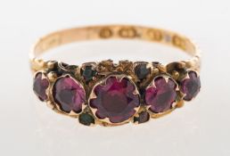 A 15ct gold Victorian ring, set with five graduated circular-cut pink stones,