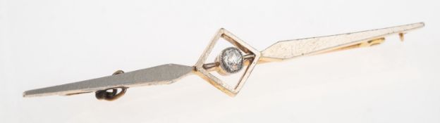 A diamond bar brooch, of geometric design and milgrain set with an old-cut diamond, marked 15ct,