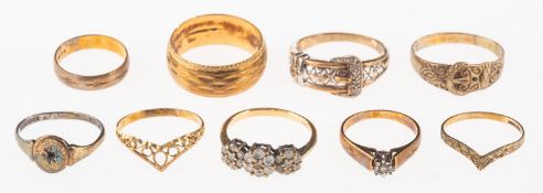 A group of nine rings, including a 9ct bi-colour buckle ring set with four single-cut diamonds,