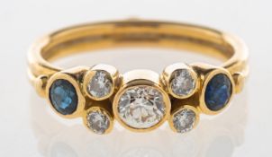 An 18ct gold handmade diamond and sapphire ring,