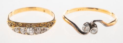 Two diamond set rings, including a ring set with five graduated old-cut diamonds,