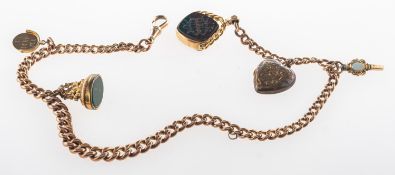 A fob chain with attached fobs and charms, a graduated link fob chain with swivel clasp,