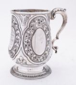 A George III silver mug, marks almost rubbed out probably London 1803, of baluster form,