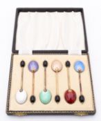 A cased set of six silver gilt and enamel coffee bean spoons by S &Co, Birmingham 1963, cased,