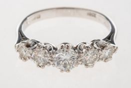 An 18ct gold five stone diamond ring, claw set with five graduated brilliant-cut diamonds,