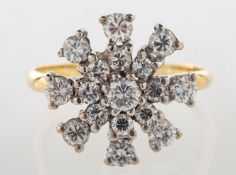 A diamond 'starburst' cluster ring, claw set with brilliant-cut diamonds, diamonds approx. 0.