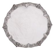 A George III silver salver by Ebenezer Coker, London 1770, circular form, with gadrooned rim,