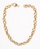 A fancy-link bracelet, of alternating textured figure of eight links and plain polished oval links,