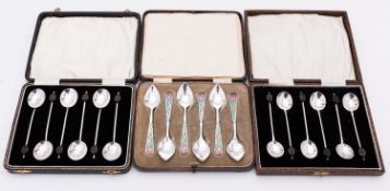 A cased set of six Arts and Crafts silver and enamel coffee spoons by Langstone Silver Works