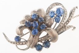 A sapphire and diamond brooch,
