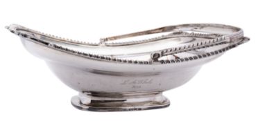 A George III silver swing handle basket by Thomas Robins, London 1809, of rectangular boat shape,
