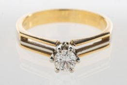 A modern bi-colour diamond ring, claw set with a single brilliant-cut diamond, approx. 0.