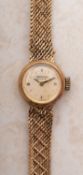 Waltham, Geneve a 9ct gold lady's wristwatch the round dial signed Waltham, Geneve,