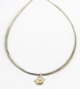 A lemon quartz and diamond pendant with a wire necklet,