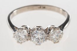 A three stone diamond ring, claw set with three brilliant-cut diamonds, diamonds approx. 1.