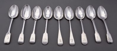 A mixed group of silver dessert spoons including; four Fiddle pattern by Thomas Wilkes Barker,