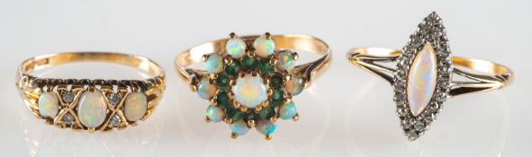 A group of three opal rings,