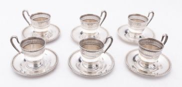 A set of six late 19th century American silver coffee cups holders and saucers by F.M.