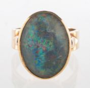 An opal triplet ring, set with an oval opal triplet, marked 9ct, size M1/2, 6.7grams.