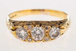 An 18ct gold three stone diamond ring,